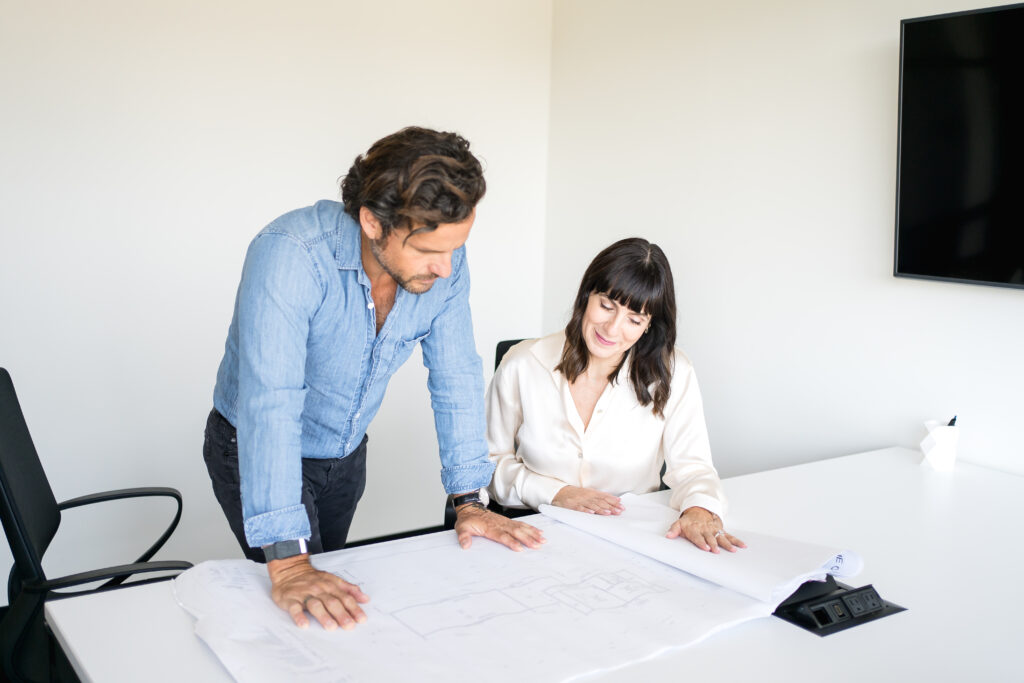 Startup founder leading a team meeting in a modern office, fostering innovation and collaboration.