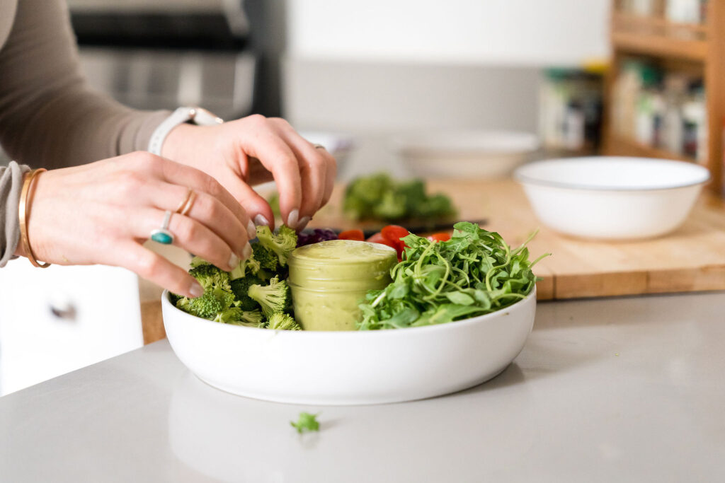 Health guru making a healthy salad for meal prep