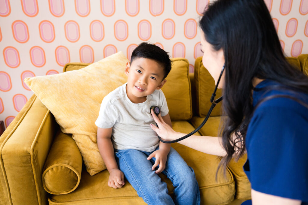 pediatrician in Austin Texas cares for smiling child