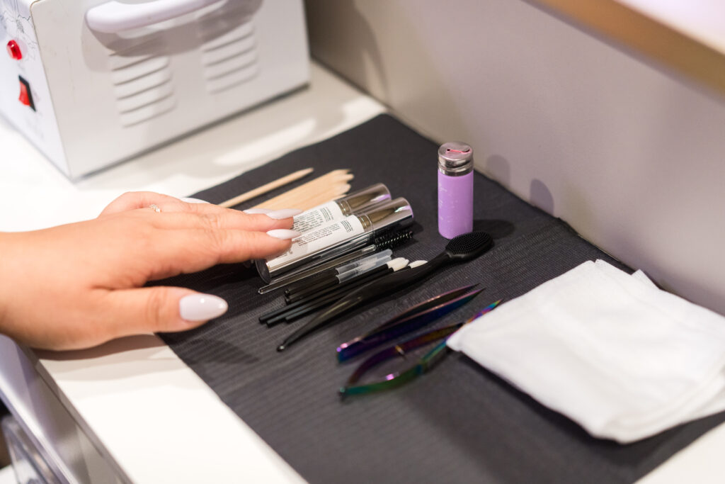Professional esthetician tools displayed before a brow service
