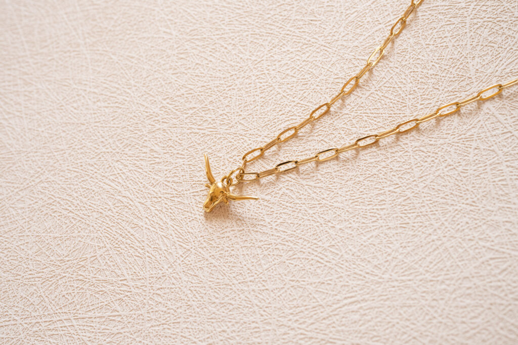 minimal jewelry flatlay showing texture and detail