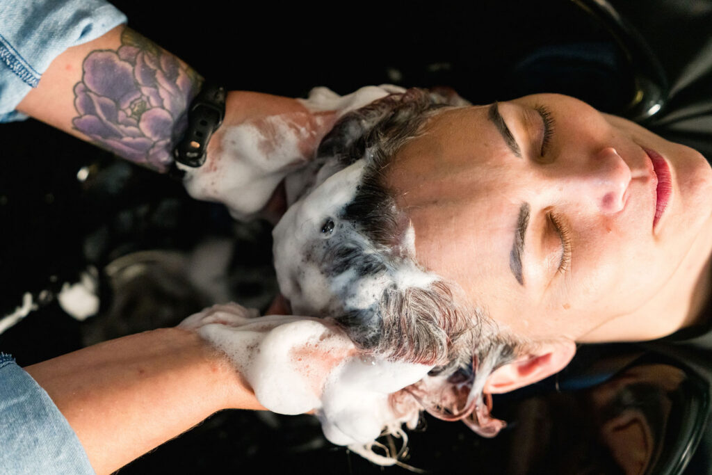 Close-up overhead shot of a hair wash at a private salon suite bowl, Verano Luxe Leander Texas