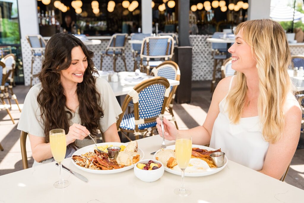 Two women brunch scene during lifestyle marketing campaign at Hill Country Galleria — commercial lifestyle
photographer Austin TX, Alissa Cordoba Brands
