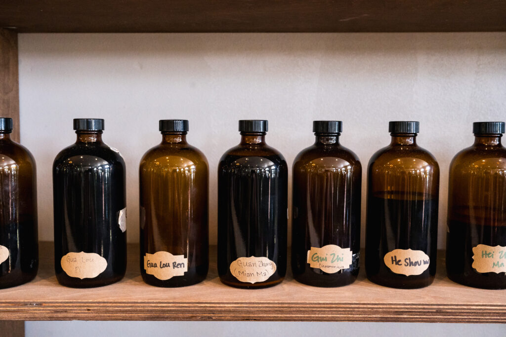 brown bottles on a shelf with natural medicine
